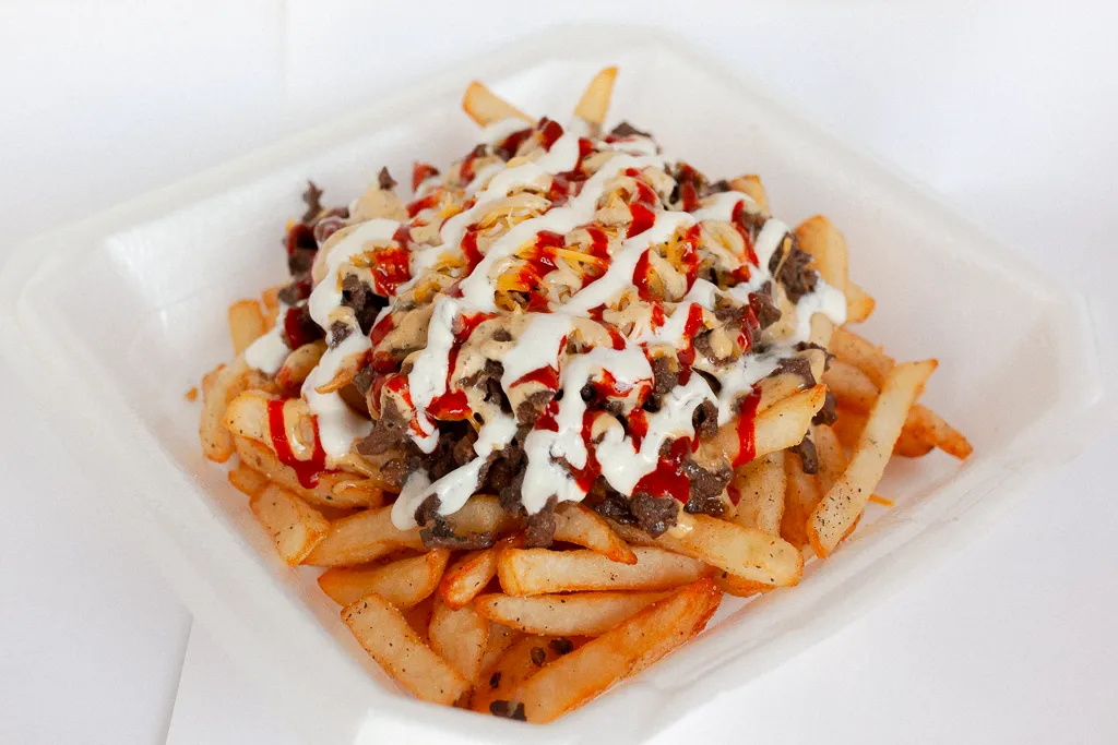 Bulgogi fries topped with beef bulgogi, cheddar-jack cheese, Seoul sauce, Sriracha and sour cream