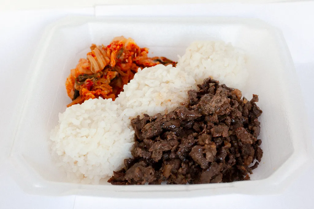 Beef bulgogi with steamed white rice and a side of kimchi